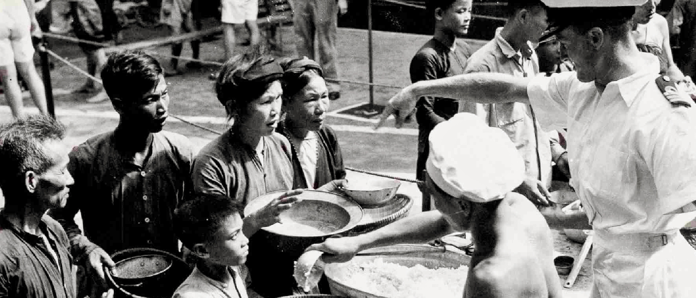 Vietnamese refugees aboard HMS Warrior after an evacuation by the Royal Navy, 1954; Crown Copyright images reproduced courtesy of The National Archives, UK.