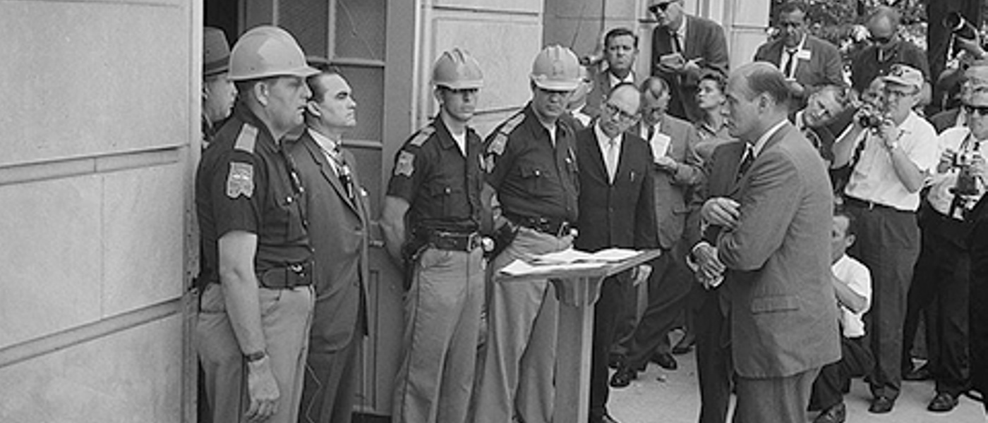 Attempting to block integration at the University of Alabama, Governor George Wallace stands at the door while being confronted by Deputy U.S. Attorney General Nicholas Katzenbach.!''